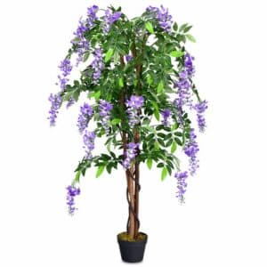 Un bouquet di fiori di diversi colori, tra cui viola, racchiuso in un mazzo di piante, fiori, viti e alberi, tra cui una particolare composizione floreale di lillà Una scena di piante in vaso che cattura unatmosfera di natura e bellezza